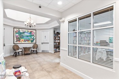 Live the good life in this upscale lakefront villa in Viera on Viera East Golf Club in Florida - for sale on GolfHomes.com, golf home, golf lot