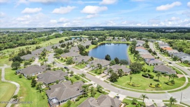 Live the good life in this upscale lakefront villa in Viera on Viera East Golf Club in Florida - for sale on GolfHomes.com, golf home, golf lot