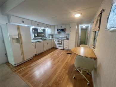 This 2-bedroom, 2-bathroom turnkey furnished mobile home in the on Heather Hills Golf Course in Florida - for sale on GolfHomes.com, golf home, golf lot