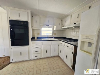 All you want is a cozy, comfortable place to live that is easy on Desert Crest Country Club in California - for sale on GolfHomes.com, golf home, golf lot