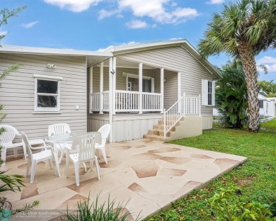 Discover your dream home in this beautifully renovated 3 bedroom on Davie Golf Club in Florida - for sale on GolfHomes.com, golf home, golf lot