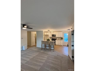 Come see this beautiful updated cozy home.  The moment you walk on Green Oaks Golf Course in Michigan - for sale on GolfHomes.com, golf home, golf lot