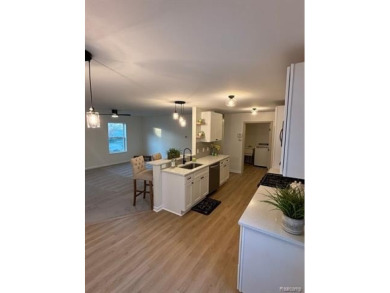 Come see this beautiful updated cozy home.  The moment you walk on Green Oaks Golf Course in Michigan - for sale on GolfHomes.com, golf home, golf lot