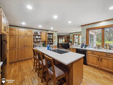 Set on nearly half an acre in Grand Blanc's sought-after Warwick on Warwick Hills Golf and Country Club in Michigan - for sale on GolfHomes.com, golf home, golf lot