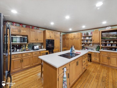 Set on nearly half an acre in Grand Blanc's sought-after Warwick on Warwick Hills Golf and Country Club in Michigan - for sale on GolfHomes.com, golf home, golf lot