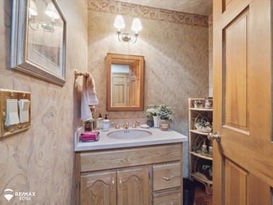 Set on nearly half an acre in Grand Blanc's sought-after Warwick on Warwick Hills Golf and Country Club in Michigan - for sale on GolfHomes.com, golf home, golf lot