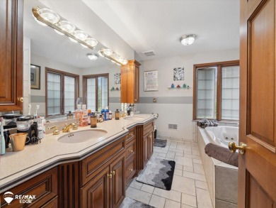 Set on nearly half an acre in Grand Blanc's sought-after Warwick on Warwick Hills Golf and Country Club in Michigan - for sale on GolfHomes.com, golf home, golf lot