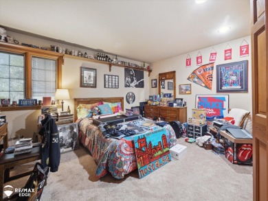 Set on nearly half an acre in Grand Blanc's sought-after Warwick on Warwick Hills Golf and Country Club in Michigan - for sale on GolfHomes.com, golf home, golf lot