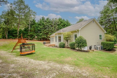 This well-kept 4 bed, 3 bath home is nestled in the heart of on Pinehurst Golf Course No. 8 in North Carolina - for sale on GolfHomes.com, golf home, golf lot