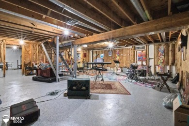 Set on nearly half an acre in Grand Blanc's sought-after Warwick on Warwick Hills Golf and Country Club in Michigan - for sale on GolfHomes.com, golf home, golf lot
