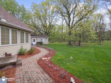 Set on nearly half an acre in Grand Blanc's sought-after Warwick on Warwick Hills Golf and Country Club in Michigan - for sale on GolfHomes.com, golf home, golf lot