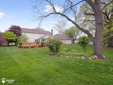 Set on nearly half an acre in Grand Blanc's sought-after Warwick on Warwick Hills Golf and Country Club in Michigan - for sale on GolfHomes.com, golf home, golf lot