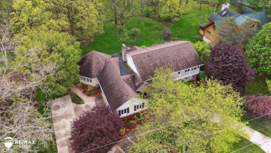 Set on nearly half an acre in Grand Blanc's sought-after Warwick on Warwick Hills Golf and Country Club in Michigan - for sale on GolfHomes.com, golf home, golf lot