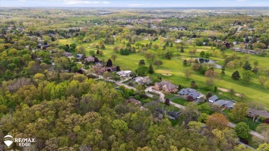 Set on nearly half an acre in Grand Blanc's sought-after Warwick on Warwick Hills Golf and Country Club in Michigan - for sale on GolfHomes.com, golf home, golf lot