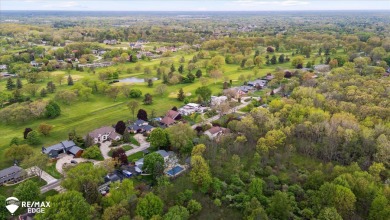Set on nearly half an acre in Grand Blanc's sought-after Warwick on Warwick Hills Golf and Country Club in Michigan - for sale on GolfHomes.com, golf home, golf lot