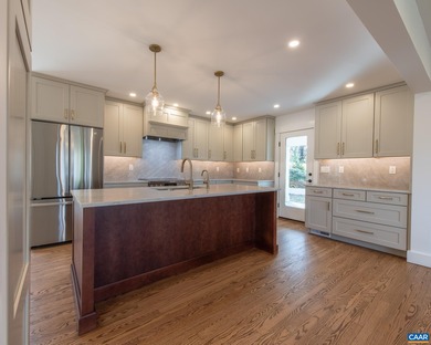 This newly remodeled 5-bedroom, 4-bath residence blends modern on Birdwood Golf Course in Virginia - for sale on GolfHomes.com, golf home, golf lot