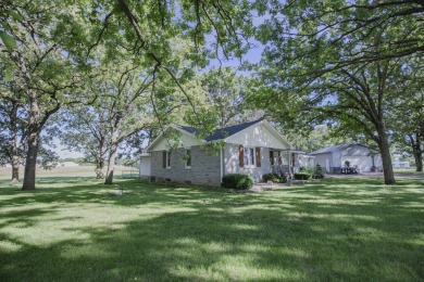 Welcome home. Located just outside of Stockton, MO, this on Stockton Country Club in Missouri - for sale on GolfHomes.com, golf home, golf lot