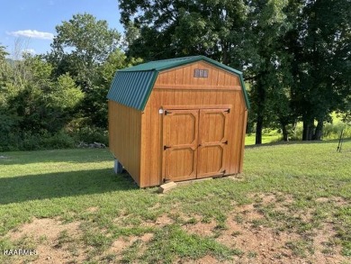 This is a beautiful, well cared for home,  It has a nice covered on Woodlake Golf Club in Tennessee - for sale on GolfHomes.com, golf home, golf lot