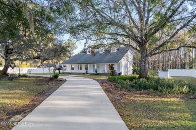 Beautifully updated all brick home nestled on 2.09 acres. 3 Bed on Palm Valley Golf Club in Florida - for sale on GolfHomes.com, golf home, golf lot