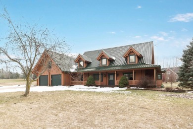 Beautiful custom log home on the 5th hole of the Mascoutin Golf on Mascoutin Country Club in Wisconsin - for sale on GolfHomes.com, golf home, golf lot