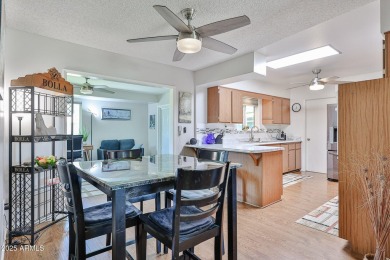 This updated home near the Sun Dial Recreation Center features a on Sun City Lakes West and East in Arizona - for sale on GolfHomes.com, golf home, golf lot