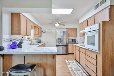 This updated home near the Sun Dial Recreation Center features a on Sun City Lakes West and East in Arizona - for sale on GolfHomes.com, golf home, golf lot