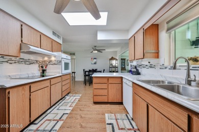 This updated home near the Sun Dial Recreation Center features a on Sun City Lakes West and East in Arizona - for sale on GolfHomes.com, golf home, golf lot