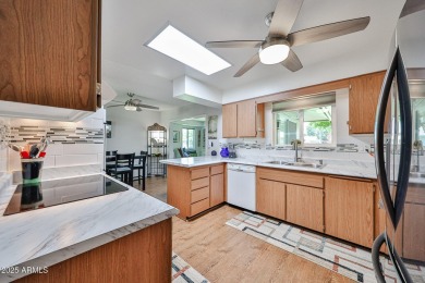 This updated home near the Sun Dial Recreation Center features a on Sun City Lakes West and East in Arizona - for sale on GolfHomes.com, golf home, golf lot