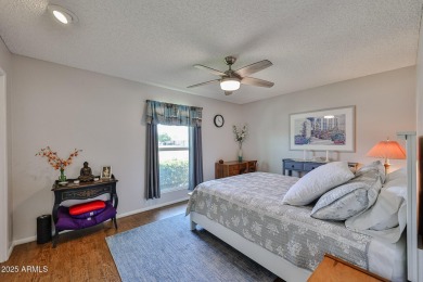 This updated home near the Sun Dial Recreation Center features a on Sun City Lakes West and East in Arizona - for sale on GolfHomes.com, golf home, golf lot