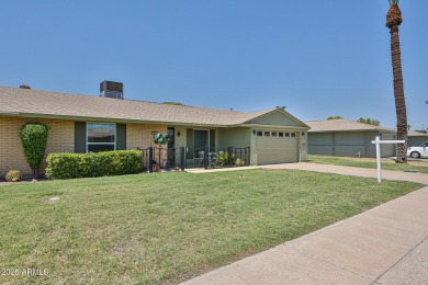 This updated home near the Sun Dial Recreation Center features a on Sun City Lakes West and East in Arizona - for sale on GolfHomes.com, golf home, golf lot