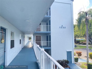 Corner 2-bedroom 2-bathroom unit with elevator and 2nd floor on Oriole Golf and Tennis Club in Florida - for sale on GolfHomes.com, golf home, golf lot