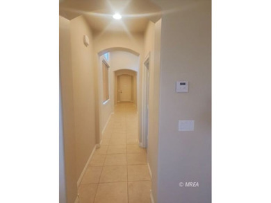 Situated along the 5th fairway and green of the Canyons Course on The Oasis Golf Club in Nevada - for sale on GolfHomes.com, golf home, golf lot