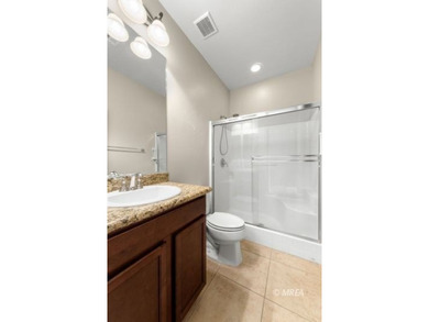 Situated along the 5th fairway and green of the Canyons Course on The Oasis Golf Club in Nevada - for sale on GolfHomes.com, golf home, golf lot