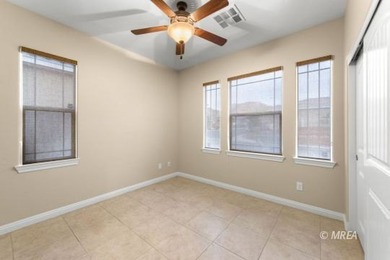 Situated along the 5th fairway and green of the Canyons Course on The Oasis Golf Club in Nevada - for sale on GolfHomes.com, golf home, golf lot