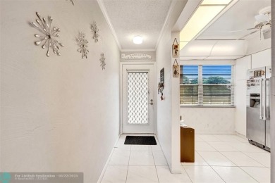 Ready to retire or just enjoy a nice vacation? Welcome to on Wynmoor Golf Course in Florida - for sale on GolfHomes.com, golf home, golf lot