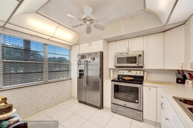 Ready to retire or just enjoy a nice vacation? Welcome to on Wynmoor Golf Course in Florida - for sale on GolfHomes.com, golf home, golf lot