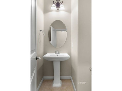 Situated along the 5th fairway and green of the Canyons Course on The Oasis Golf Club in Nevada - for sale on GolfHomes.com, golf home, golf lot