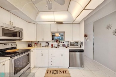 Ready to retire or just enjoy a nice vacation? Welcome to on Wynmoor Golf Course in Florida - for sale on GolfHomes.com, golf home, golf lot