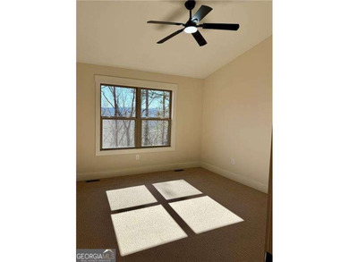 Welcome to this custom-built modern craftsman cabin nestled on White Path Golf Club in Georgia - for sale on GolfHomes.com, golf home, golf lot