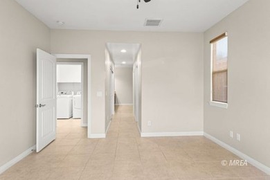 Situated along the 5th fairway and green of the Canyons Course on The Oasis Golf Club in Nevada - for sale on GolfHomes.com, golf home, golf lot