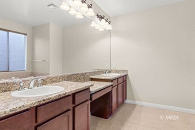 Situated along the 5th fairway and green of the Canyons Course on The Oasis Golf Club in Nevada - for sale on GolfHomes.com, golf home, golf lot