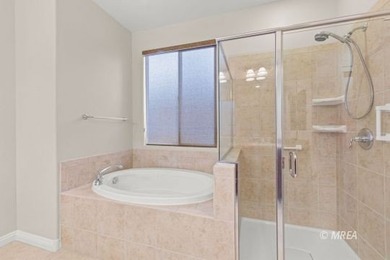 Situated along the 5th fairway and green of the Canyons Course on The Oasis Golf Club in Nevada - for sale on GolfHomes.com, golf home, golf lot