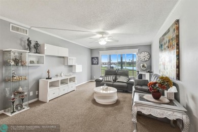 Ready to retire or just enjoy a nice vacation? Welcome to on Wynmoor Golf Course in Florida - for sale on GolfHomes.com, golf home, golf lot