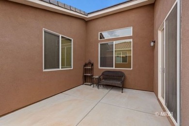 Situated along the 5th fairway and green of the Canyons Course on The Oasis Golf Club in Nevada - for sale on GolfHomes.com, golf home, golf lot