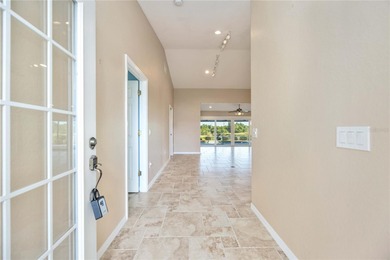 Beautifully updated 3-bedroom, 2-bath split-floor-plan pool home on Oyster Creek Golf Club in Florida - for sale on GolfHomes.com, golf home, golf lot