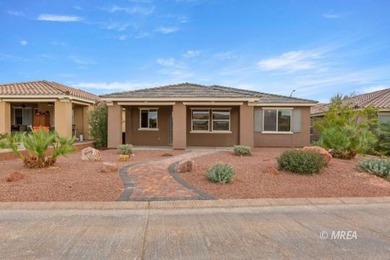 Situated along the 5th fairway and green of the Canyons Course on The Oasis Golf Club in Nevada - for sale on GolfHomes.com, golf home, golf lot