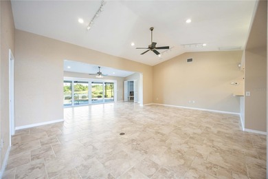 Beautifully updated 3-bedroom, 2-bath split-floor-plan pool home on Oyster Creek Golf Club in Florida - for sale on GolfHomes.com, golf home, golf lot