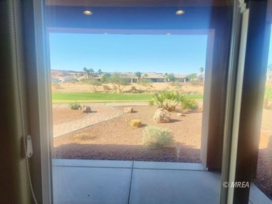 Situated along the 5th fairway and green of the Canyons Course on The Oasis Golf Club in Nevada - for sale on GolfHomes.com, golf home, golf lot