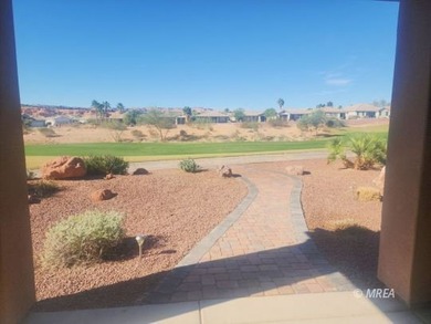 Situated along the 5th fairway and green of the Canyons Course on The Oasis Golf Club in Nevada - for sale on GolfHomes.com, golf home, golf lot