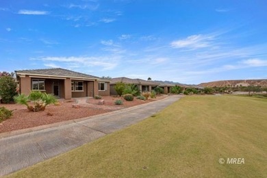 Situated along the 5th fairway and green of the Canyons Course on The Oasis Golf Club in Nevada - for sale on GolfHomes.com, golf home, golf lot